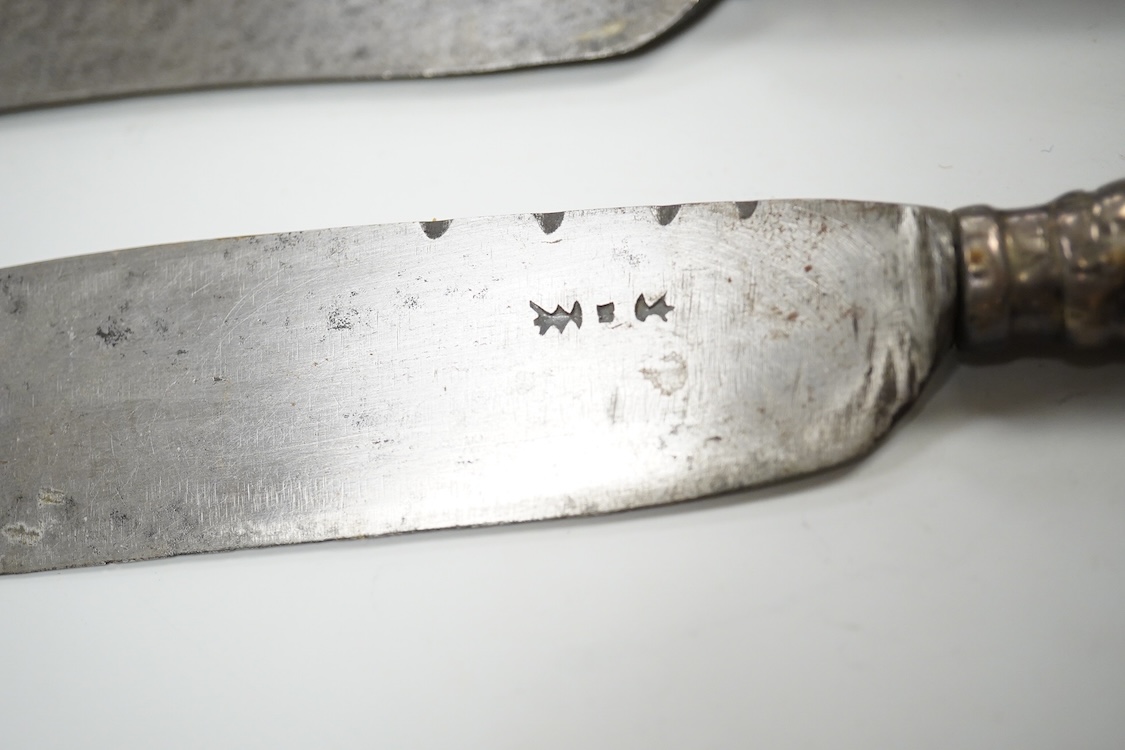 Three 17th / 18th century steel bladed knives, one in a leather sheath with matching fork. Longest 24cm.